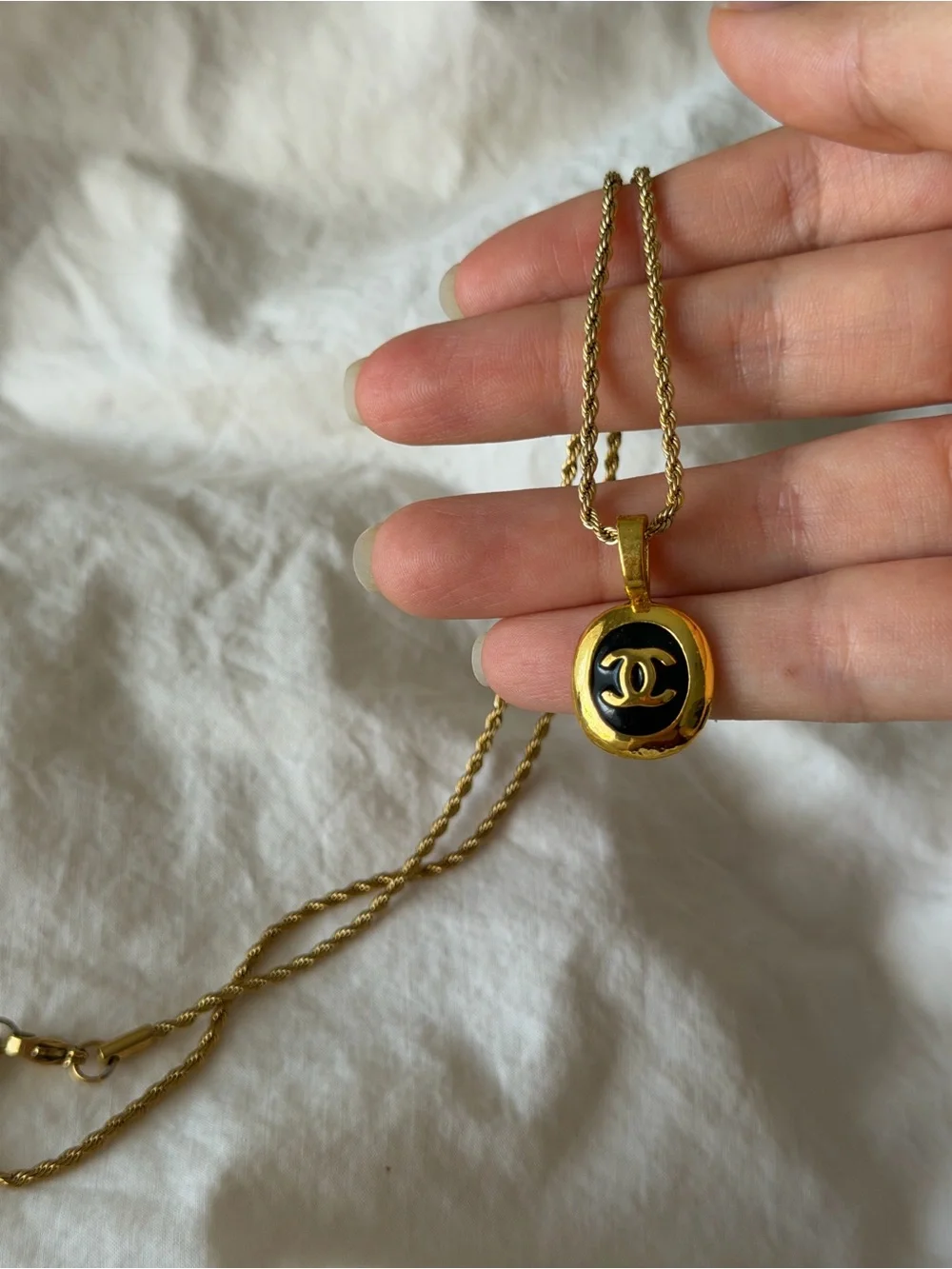 CHANEL Gold and Black Oval CC Pendant Necklace on Rope Chain